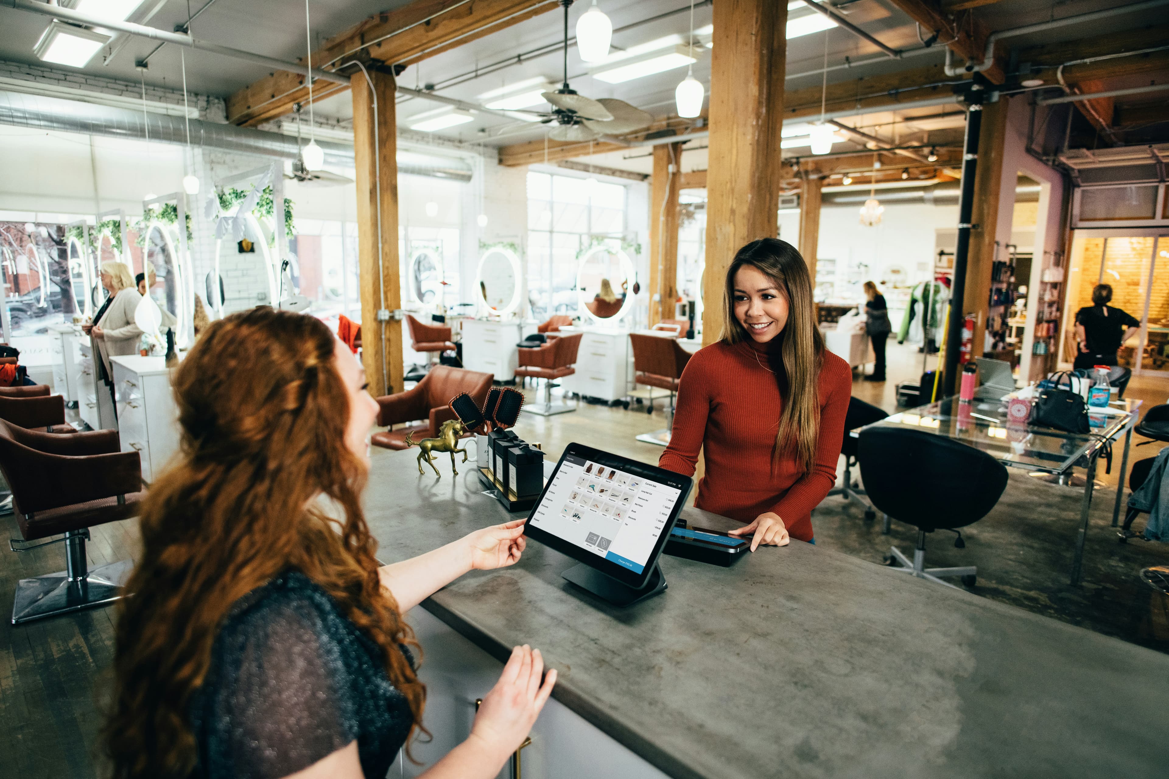 A small business owner at work in a retail storefront